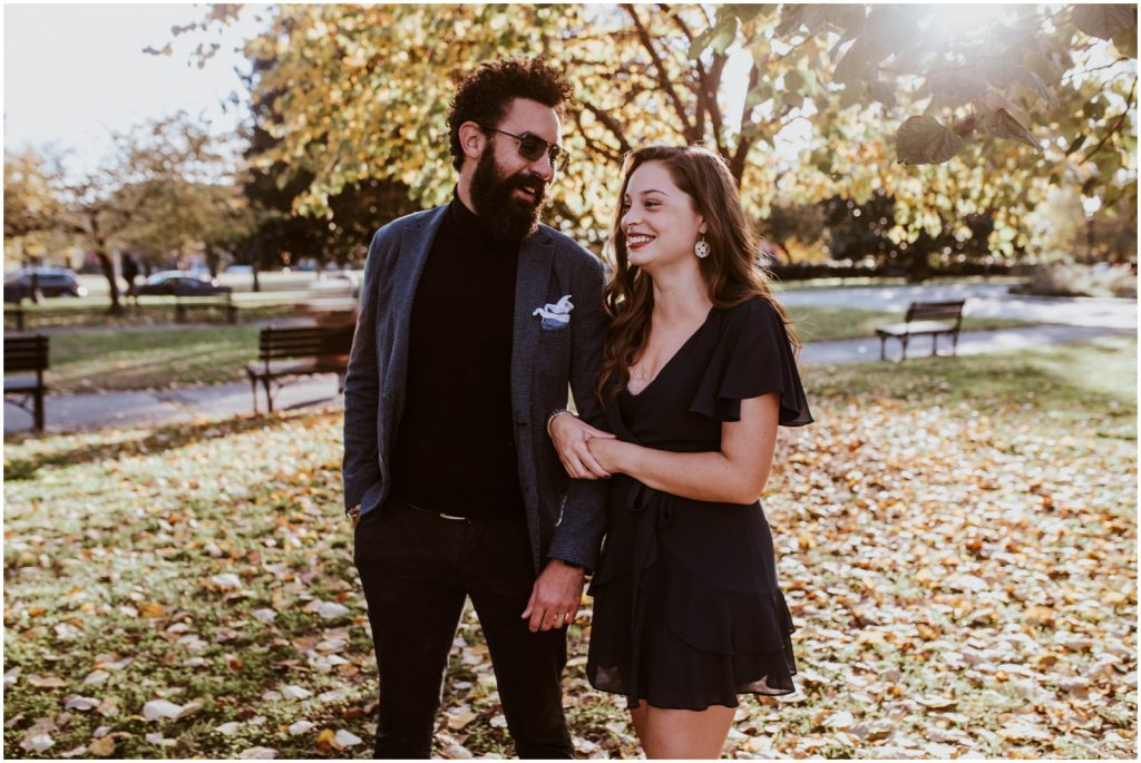 bride and groom pose among fallen leaves in DC