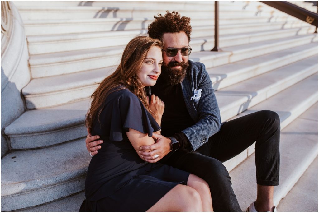 bride and groom sit on steps of Capitol Building