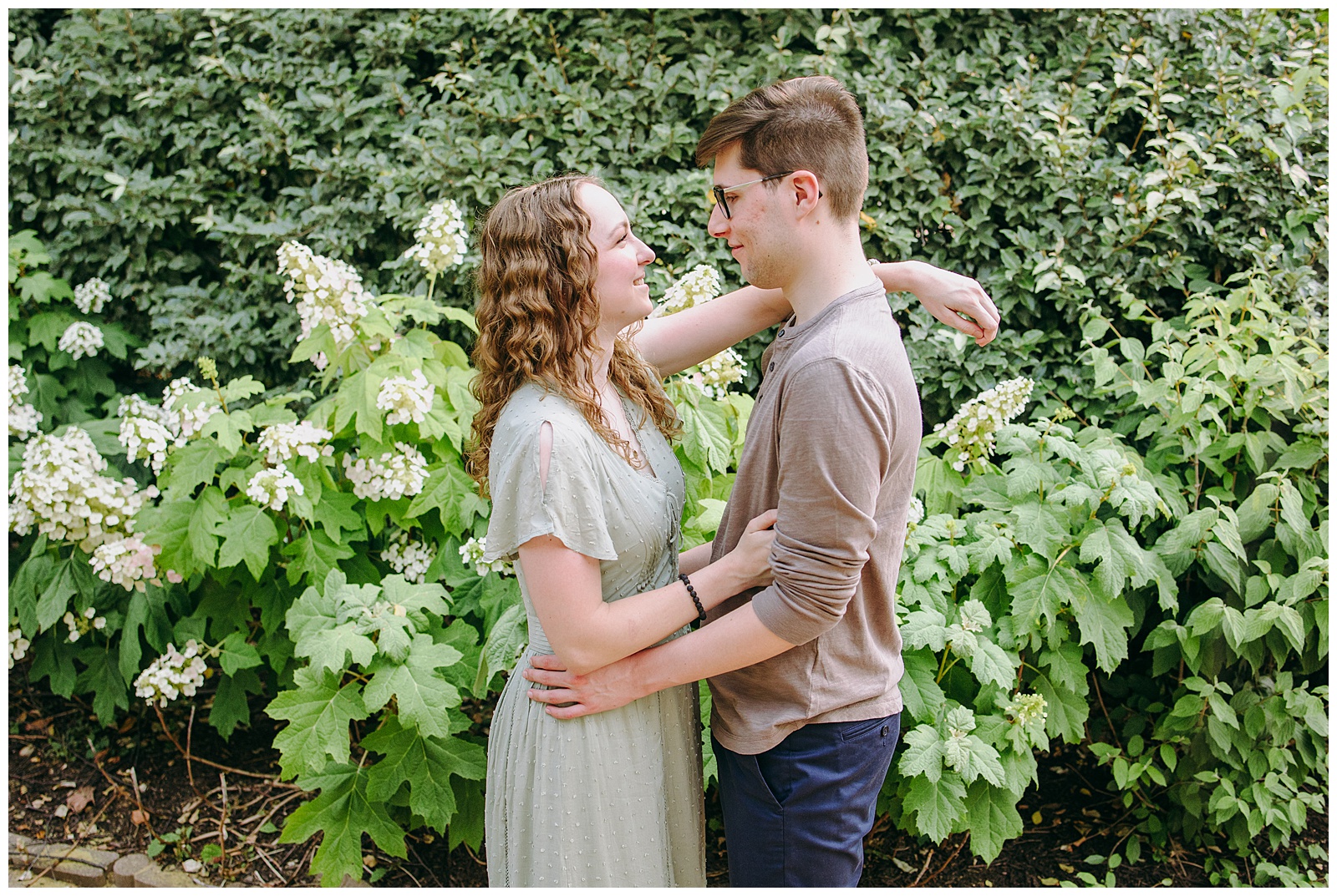 Lansdowne Resort Couples Portraits in front of summer hydrangeas